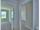 Carpeted bedroom featuring a window with a view of the property at 4694 Grandview Glen Dr, Auburndale, FL 33823