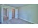 Spacious carpeted bedroom featuring a walk-in closet and ensuite bathroom at 4694 Grandview Glen Dr, Auburndale, FL 33823