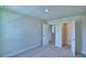 Neutral carpeted bedroom with a walk-in closet and an ensuite bathroom at 4694 Grandview Glen Dr, Auburndale, FL 33823