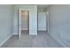 View of a carpeted bedroom featuring a walk-in closet and ensuite bathroom at 4694 Grandview Glen Dr, Auburndale, FL 33823