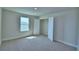 Bedroom featuring a closet, window, neutral carpet, and white trim at 4694 Grandview Glen Dr, Auburndale, FL 33823