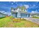 Charming two-story home featuring a well-maintained lawn and a brick paver driveway at 4694 Grandview Glen Dr, Auburndale, FL 33823