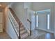Bright foyer featuring wood-look tile flooring, staircase, and a front door with sidelight at 4694 Grandview Glen Dr, Auburndale, FL 33823