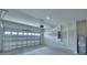 Spacious and clean two car garage with an automatic door and room for storage at 4694 Grandview Glen Dr, Auburndale, FL 33823