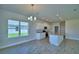 Bright kitchen with granite countertops, stainless appliances, and ample cabinet space at 4694 Grandview Glen Dr, Auburndale, FL 33823