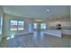 Open-concept area with tile flooring, abundant natural light, and modern finishes at 4694 Grandview Glen Dr, Auburndale, FL 33823