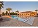 Community pool with palm trees and lounge chairs in the evening at 4694 Grandview Glen Dr, Auburndale, FL 33823