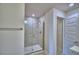 Bathroom with tiled shower and glass door at 4700 Grandview Glen Dr, Auburndale, FL 33823