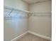 Walk-in closet with carpeted floor and wire shelving at 4700 Grandview Glen Dr, Auburndale, FL 33823
