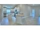 Open-concept kitchen with granite countertops, stainless steel appliances, and an island with bar seating at 4700 Grandview Glen Dr, Auburndale, FL 33823
