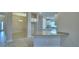 Open kitchen with stainless appliances, granite counters, island, and a view to the dining area at 4700 Grandview Glen Dr, Auburndale, FL 33823