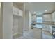 Bright kitchen with white cabinetry, granite countertops, and stainless steel appliances at 4700 Grandview Glen Dr, Auburndale, FL 33823