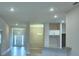 Spacious living area with recessed lighting, neutral paint, and open floor plan to kitchen at 4700 Grandview Glen Dr, Auburndale, FL 33823