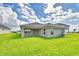Backyard features a lush lawn and outdoor patio, perfect for entertaining at 4706 Grandview Glen Dr, Auburndale, FL 33823