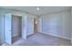 Bedroom showcasing a closet with shelving and access to other rooms at 4706 Grandview Glen Dr, Auburndale, FL 33823