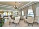 Bright common room featuring comfortable chairs, tables, and ample natural light from large windows at 4706 Grandview Glen Dr, Auburndale, FL 33823