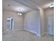 Elegant dining room featuring decorative wainscoting and a modern chandelier fixture at 4706 Grandview Glen Dr, Auburndale, FL 33823