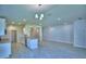 Open-concept living space featuring kitchen with granite countertops and stainless steel appliances at 4706 Grandview Glen Dr, Auburndale, FL 33823