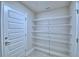 Spacious pantry with ample shelving for organized storage solutions at 4706 Grandview Glen Dr, Auburndale, FL 33823