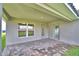 Covered outdoor patio with brick pavers, offering a relaxing outdoor living space at 4706 Grandview Glen Dr, Auburndale, FL 33823
