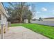 Expansive backyard featuring a well-manicured lawn, storage shed and privacy fence at 5225 Golden Gate Blvd, Polk City, FL 33868