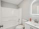 This bathroom features a well lit sink, a tub, and a toilet at 5225 Golden Gate Blvd, Polk City, FL 33868