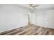 Bedroom with wood-look floors and ceiling fan at 5225 Golden Gate Blvd, Polk City, FL 33868