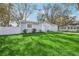 Charming single-story home featuring a well-manicured lawn, tasteful landscaping, and a freshly painted exterior at 5225 Golden Gate Blvd, Polk City, FL 33868