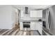 Modern kitchen boasts stainless steel appliances and granite countertops at 5225 Golden Gate Blvd, Polk City, FL 33868