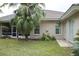 Well-maintained backyard with lush greenery, lawn, and ample natural light at 108 Lake Region N Blvd, Winter Haven, FL 33881
