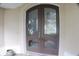 Close up of the entryway featuring beautiful double doors with glass panels and an arched transom at 108 Lake Region N Blvd, Winter Haven, FL 33881