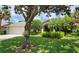 Charming single-story home with lush landscaping, mature trees, and a well-maintained lawn at 108 Lake Region N Blvd, Winter Haven, FL 33881