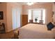 Cozy bedroom with a large window, and a bed with cozy bedding at 108 Lake Region N Blvd, Winter Haven, FL 33881