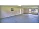 Spacious garage with painted floor and ample storage at 116 Bishop St, Auburndale, FL 33823