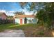 Home features a grassy backyard with a fenced perimeter at 506 N Wales Dr, Lake Wales, FL 33853