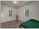 Simple bedroom with laminate floors and a double bed at 506 N Wales Dr, Lake Wales, FL 33853