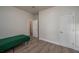 Spacious bedroom with laminate flooring and a large closet at 506 N Wales Dr, Lake Wales, FL 33853