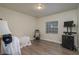 Bright bedroom with wood-look floors and ample space for furniture at 506 N Wales Dr, Lake Wales, FL 33853