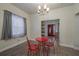 Charming dining area with red metal table and chairs at 506 N Wales Dr, Lake Wales, FL 33853