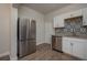 Updated kitchen with stainless steel appliances and ample cabinet space at 506 N Wales Dr, Lake Wales, FL 33853