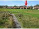 Ground view of path adjacent to homes at 5225 Imperial Lakes Blvd # 22, Mulberry, FL 33860