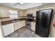 Galley kitchen with stainless steel appliances and wood cabinets at 5225 Imperial Lakes Blvd # 22, Mulberry, FL 33860