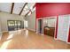 Living room with access to a screened porch and wood beams at 5225 Imperial Lakes Blvd # 22, Mulberry, FL 33860
