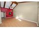 Bright living room with vaulted ceiling, wood beams, and laminate flooring at 5225 Imperial Lakes Blvd # 22, Mulberry, FL 33860