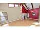 Spacious living room featuring high ceilings, wood beams, and laminate floors at 5225 Imperial Lakes Blvd # 22, Mulberry, FL 33860