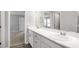 Bathroom featuring double sinks, quartz countertops, and modern fixtures at 572 Sw 77Th Cir, Ocala, FL 34480