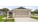 Charming one-story home with a two-car garage and well-maintained landscaping at 572 Sw 77Th Cir, Ocala, FL 34480