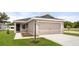 Charming one-story home with a two-car garage, inviting walkway, and well-maintained landscaping at 572 Sw 77Th Cir, Ocala, FL 34480