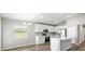 Modern kitchen features quartz countertops, stainless steel appliances, and eat in area at 572 Sw 77Th Cir, Ocala, FL 34480