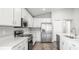 Modern kitchen features quartz countertops and stainless steel appliances at 572 Sw 77Th Cir, Ocala, FL 34480